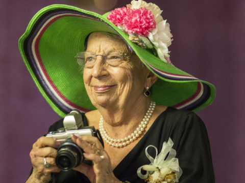 Grandmother at a wedding taking pictures