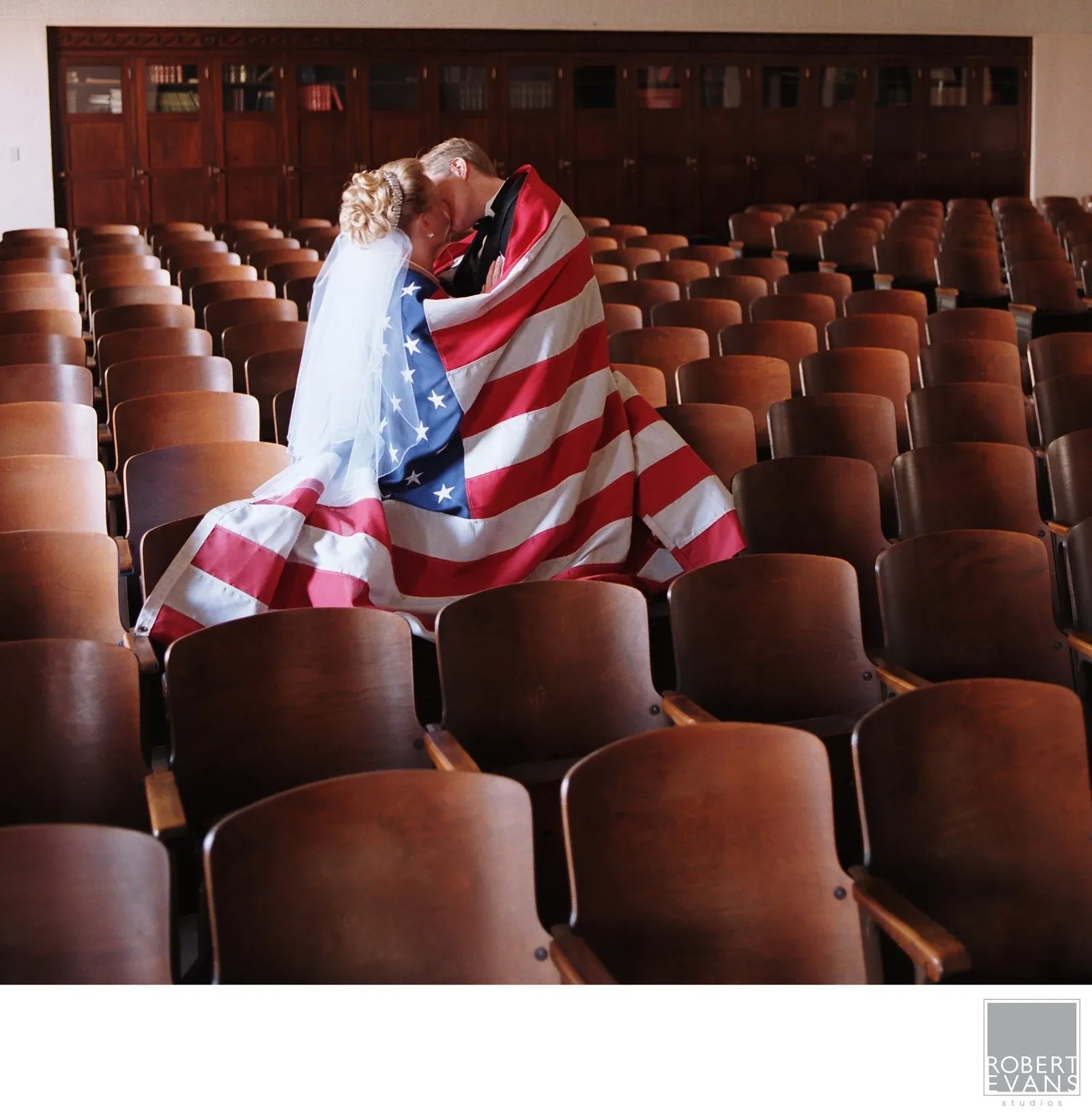 Red White And Blue Kiss A woman wrapped in an American flag among theater seats