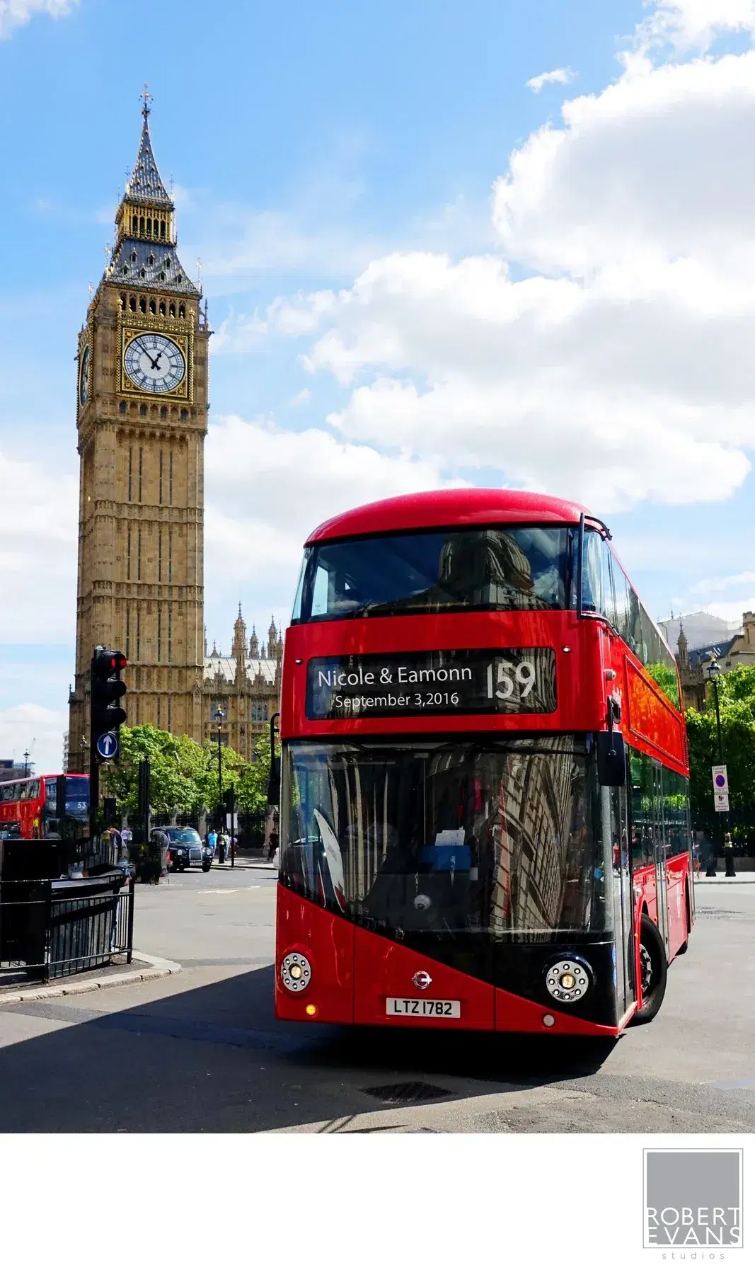 A red double-decker bus passing the Elizabeth Tower in London A red double-decker bus passing the Elizabeth Tower in London